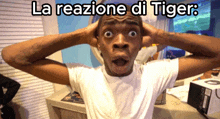 a man with his hands on his head and the words la reazione di tiger on the bottom
