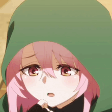 a girl with pink hair wearing a green hoodie