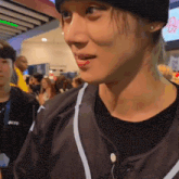 a close up of a person wearing a beanie and a jersey that says tokyo