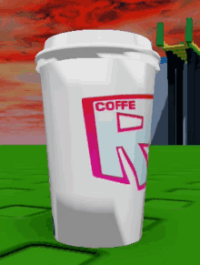 a white cup with a pink r on it that says coffe