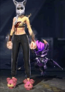 a woman in a cat mask is standing next to a purple monster .