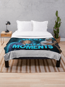 a bed with a blanket on it that says best moments