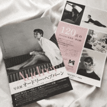 a magazine with a picture of audrey hepburn is on a white cloth