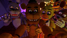 a group of five nights at freddy 's characters pose for a photo