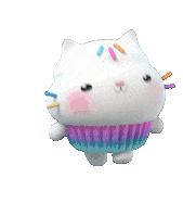 a stuffed cat shaped like a cupcake with sprinkles on it 's face