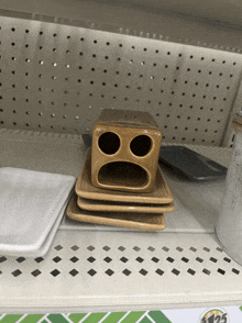 a stack of ceramic plates on a shelf with a sign that says $ 125