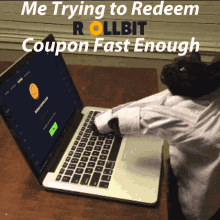 a black cat is typing on a laptop with the words me trying to redeem rollbit coupon fast enough