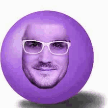 a purple ball with a man 's face on it and glasses .