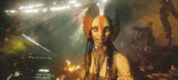 a painting of a woman with dreadlocks and a feathered headpiece