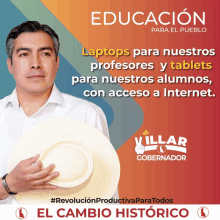 a man holding a white hat with the words " educacion para el pueblo " on the top