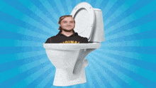 a man in a hoodie with the word original on it sits in a toilet