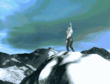 a woman stands on top of a snowy mountain