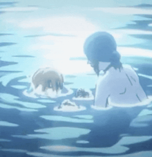 a woman is taking a bath in the ocean
