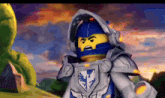 a lego knight with a blue helmet and a shield on his chest is standing in front of a green monster .