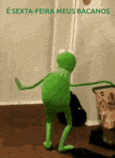 a kermit the frog is dancing in a room with the words e sexta-feira meus bacanos above him