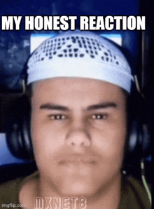 a man wearing headphones and a headband with the words my honest reaction on it