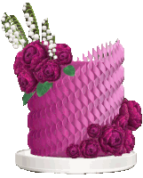 a pink cake with purple roses and lily of the valley on top