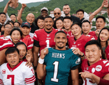 a group of people posing for a picture including a man wearing a number 1 jersey