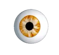 a close up of a white eye with a yellow pupil