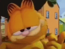 garfield the cat is standing in front of a house .