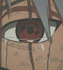 a close up of a naruto character 's eye with tears coming out of it .