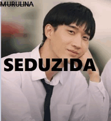 a man in a white shirt and tie with the word seduzida on the bottom right