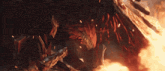 a knight is standing next to a large red dragon with flames coming out of its mouth