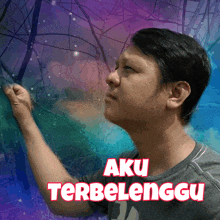 a man is standing in front of a purple and blue background with aku terbelenggo written on it