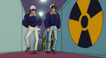 two men are standing next to each other in a hallway with a nuclear symbol in the background