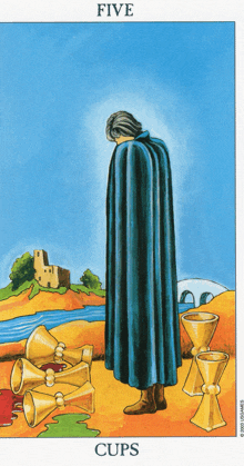 a tarot card shows a man in a cape and the word cups underneath