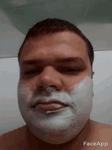 a man with shaving cream on his face and the word faceapp on the bottom right