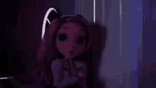 a doll with pink hair is standing in a dark room with a purple light behind her .