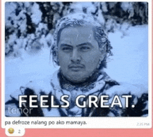 a man is covered in snow and has the words `` feels great '' on his face .