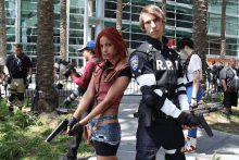 a man and a woman dressed as r.p.d. holding guns