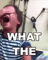 a person covering their face with their hand and the words " what the " written above them