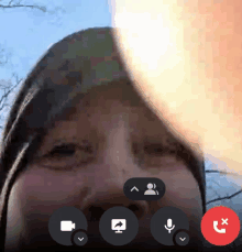 a person 's face is visible in a video call with a red x on the bottom right corner