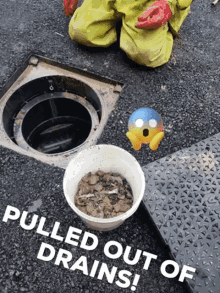 a person is kneeling next to a drain with a bowl of dirt in front of it and the words pulled out of drains