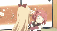 two anime girls are hugging each other in front of a wall with flowers on it