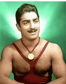 a man with a medal around his neck is smiling for the camera