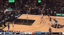 a basketball game is being played on a court with sprite ads