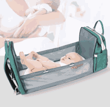 a baby is laying in a crib with a diaper bag attached