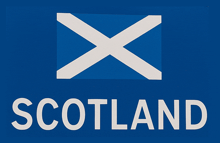 a blue sign with a white x and the word scotland on it