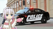 a police car is parked in front of a building with a girl in front of it .