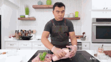 a man in an apron is preparing food in a kitchen with the words made in animatica on the bottom right