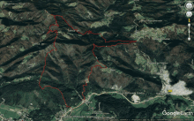 an aerial view of a mountain range with a google earth icon