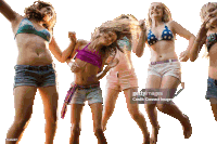 a group of young girls are jumping in the air