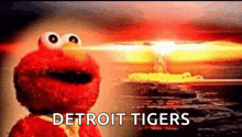 elmo from sesame street is standing in front of a nuclear explosion and the words detroit tigers