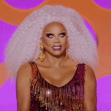 a drag queen with white hair and purple lipstick is wearing a sequined dress .