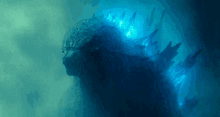 a picture of a monster with blue lights coming out of it 's mouth