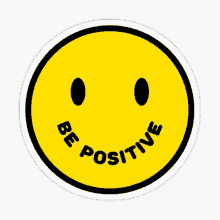 a yellow smiley face with black eyes and the words be positive around it